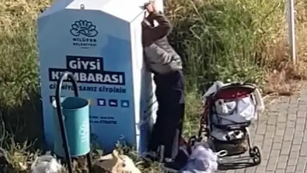 Giysi kumbarasından kıyafet çaldılar
