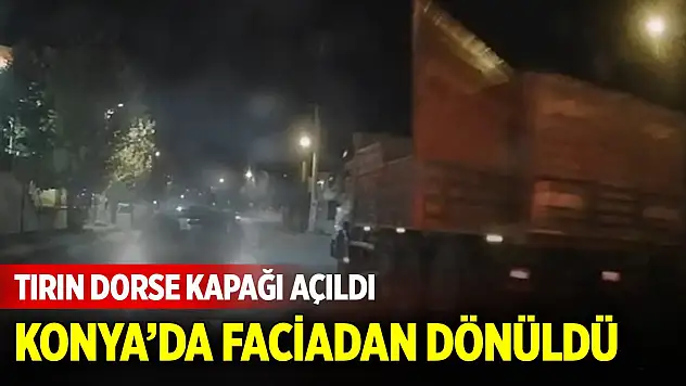 Tırın dorse kapağı açıldı, kırmızı ışıkta bekleyen otomobil kıl payı kurtuldu