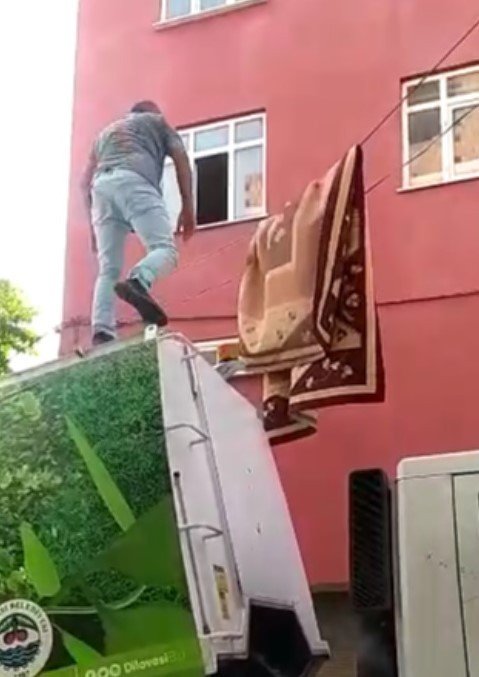 Halısı 5. kattan tellerin üzerine düştü, yardımına belediye personeli koştu