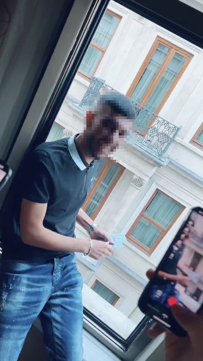 Otel penceresinden dolar saçan şahıs yakalandı