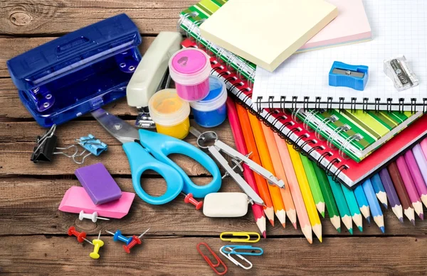 depositphotos-118712350-stock-photo-school-supplies-on-background.jpg